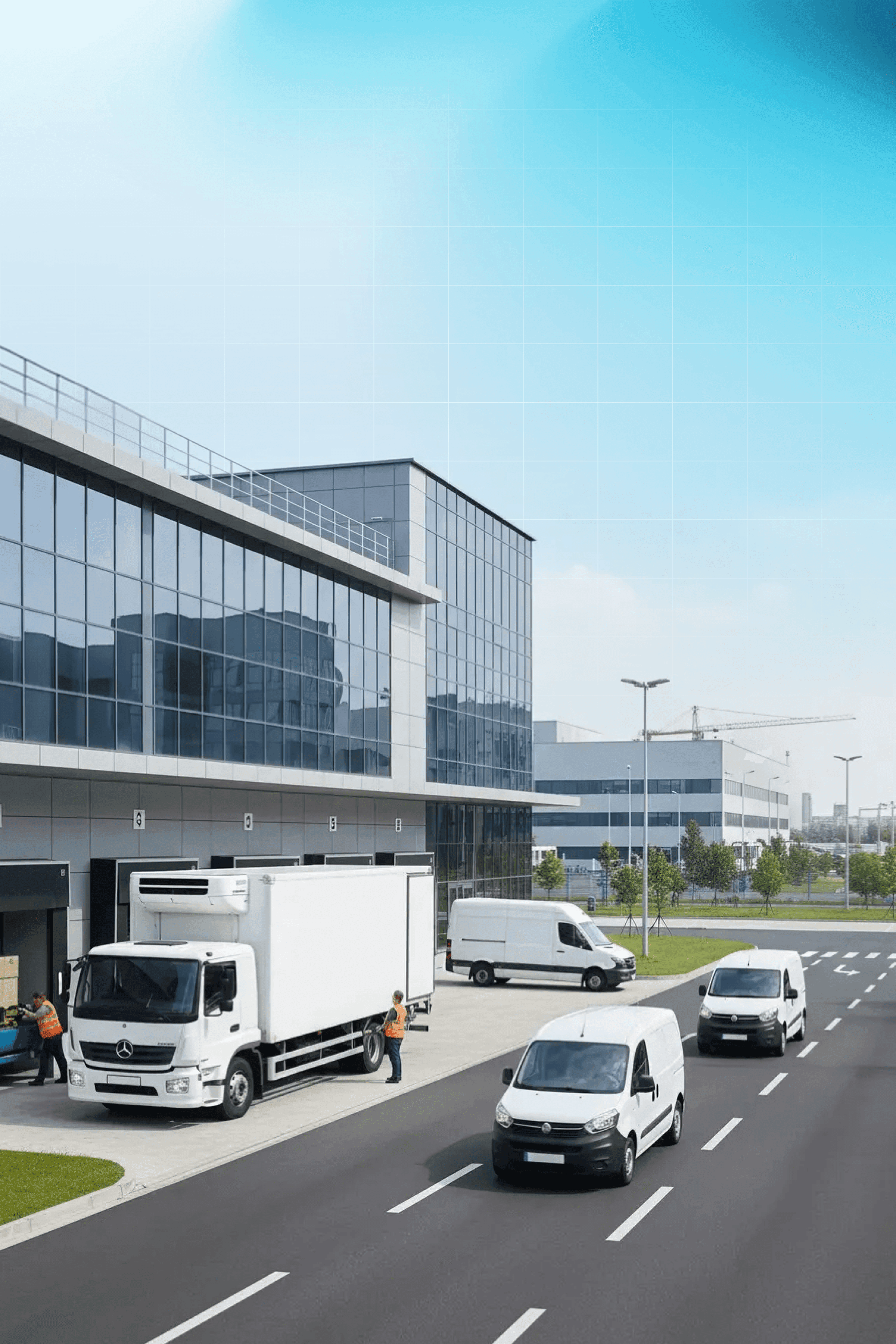 Trucks leaving from a commercial auto facility.