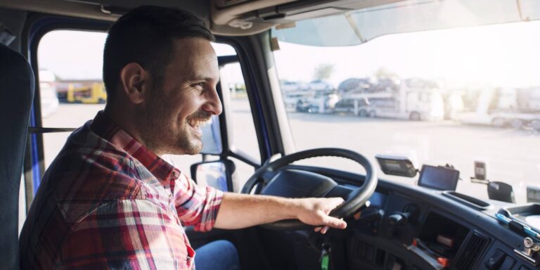 Person driving a truck, representing transportation risk management.